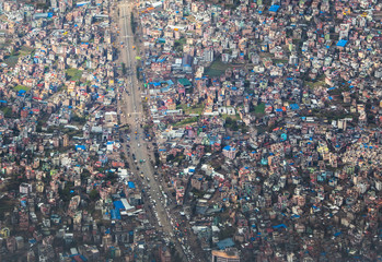 Top view on chaos of colored buildings - the heap of houses in the Asian cities caused by big overpopulation. - obrazy, fototapety, plakaty