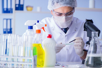 Man in the lab testing new cleaning solution detergent