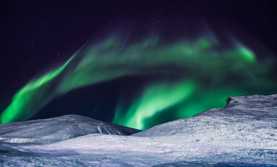 The polar arctic Northern lights aurora borealis sky star in Norway Svalbard in Longyearbyen city...