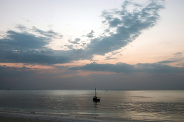 Sailing boat at sunset.