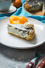 Pieces of delicious poppy seed cheesecake and peach