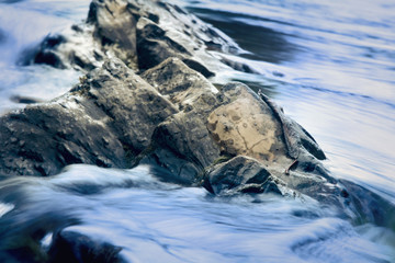 Long exposure shot of rapid mountain river. Water texture background.