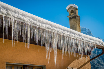 Ice stalactites on a roof