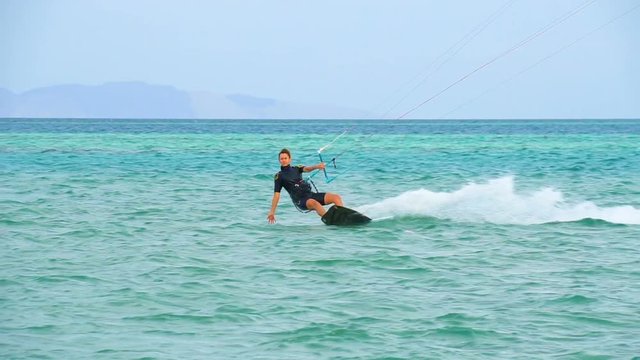 Young girl Kite Surfing In Ocean, Extreme summer sport hd, slow motion
