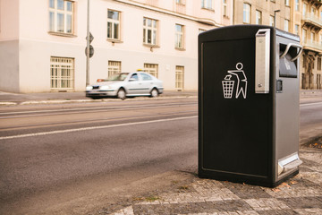 A modern smart trash can on the street in Prague in the Czech Republic. Collection of waste in Europe for subsequent disposal. Eco-friendly waste collection.