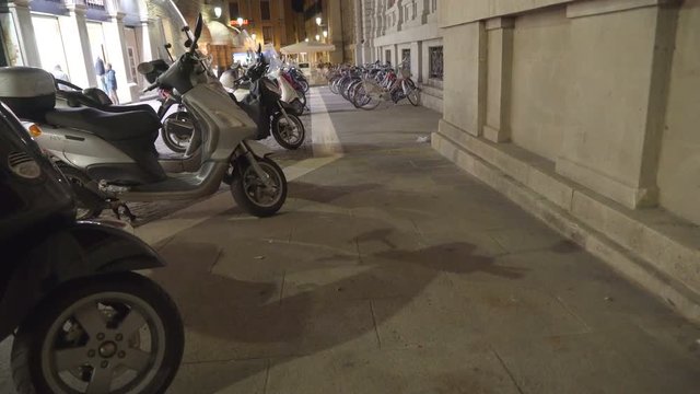 14932_Lots_of_motorcycles_and_bicycles_parked_on_the_side.mov