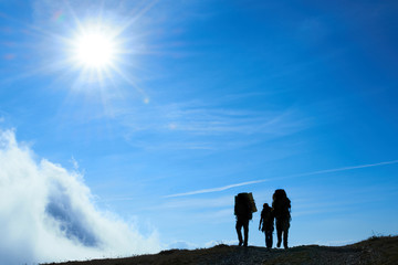 Silhouette of hiking friends