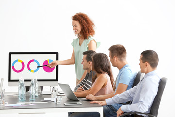 Group of people with business trainer at seminar