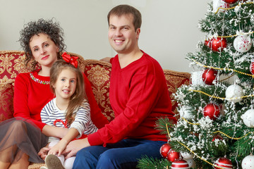 The young family celebrates New year.