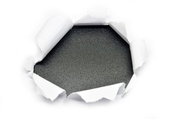 Hole in the paper with torn side