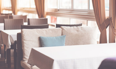 Comfortable place. Light hall being full of wicker furniture ready for receiving guests