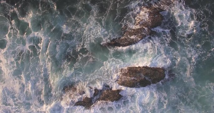 Birds Eye View Waves Crashing On the Rocks