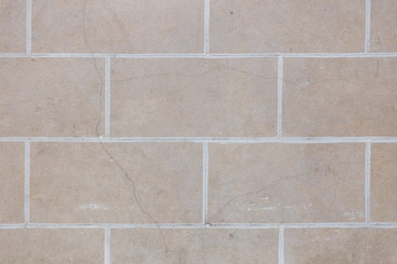 Wall pattern with bricks and cement, background texture