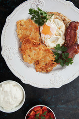 Hash browns with egg and bacon