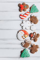 Christmas homemade gingerbread cookies on wooden table.