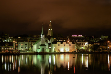 Fototapeta na wymiar Reykjavik city seen from the pond at night
