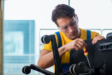 Furniture repairman working on repairing the chair