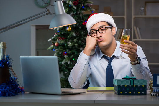 Businessman working late on christmas day in office