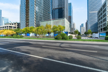 city empty traffic road with cityscape in background.