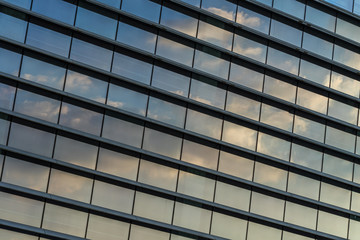 Clouds Reflected in Windows of Modern Office Building..