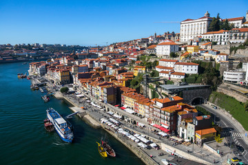 Fototapeta na wymiar Douro river and Ribeira embankment in the historical centre of Porto, Portugal.