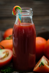 Still life of fresh ripe tomatoes juice