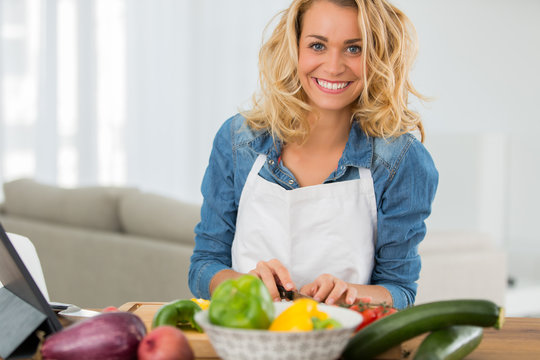 Woman Cooking In Kitchen