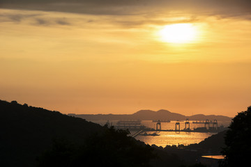 Obraz premium comercial container port at sunset