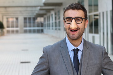 Businessman wearing fake nose-glasses combo