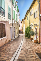 Fototapeta na wymiar Colorful, narrow street of homes in Europe