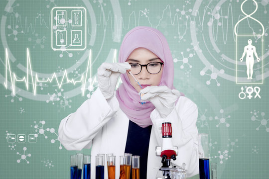 Muslim scientist working in the laboratory