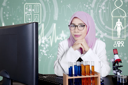 Muslim scientist looks pensive in the laboratory