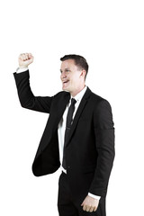 Happy businessman expressing his success on studio