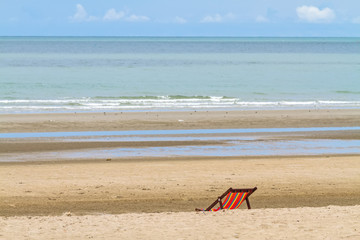 Fototapeta na wymiar Empty chairs on the beach for relax