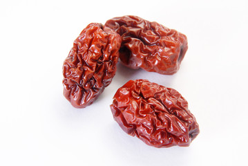 Three jujubes on a white background 