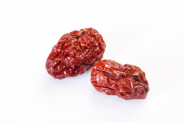 Two jujubes on a white background     