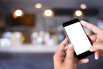 man hands use  smartphone blank screen in  in coffee cafe background For Graphic display montage.