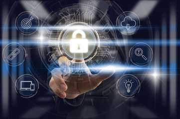 Businessman Finger touching the key icon for security access with technology icon over the light from blur server room background, Cyber Security Data Protection support Technology Privacy concept.