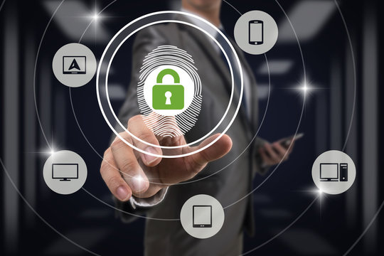 Businessman Fingerprint scan and pressing technology lock security for unlock all Information technology device over blurred data center server room background, Business Technology sceurity Concept.