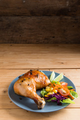 Roasted chicken leg with sauce and black pepper