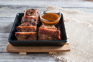 Grilled barbecue pork ribs on plate table background