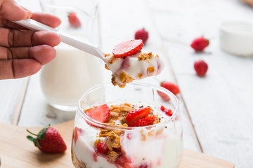 Strawberry , granola and yogurt healthy breakfast parfait