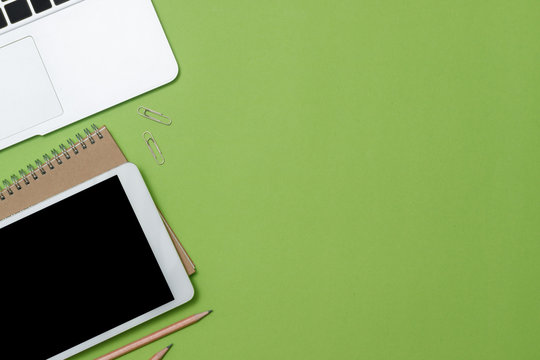 Top View Workspace Mockup On Green Desk With Laptop And Tablet,  Free Space Add  Your Own.