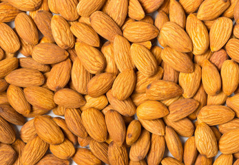 Shelled almond kernels background