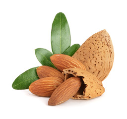 Group of almond nuts with leaves isolated on white background