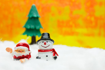 Santa cross doll and Christmas tree and Snowman and Snow. Concept Christmas Day.