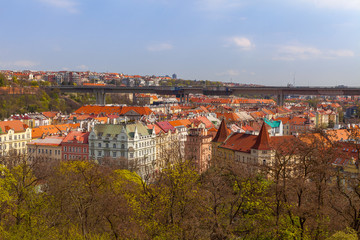 Prague living blocks red rooftops with park and trees