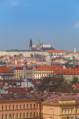 Prague rooftops. Beautiful aerial view of Czech baroque architecture and St. Vitus Cathedral.