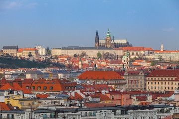 Fototapeta na wymiar Prague rooftops. Beautiful aerial view of Czech baroque architecture and St. Vitus Cathedral.