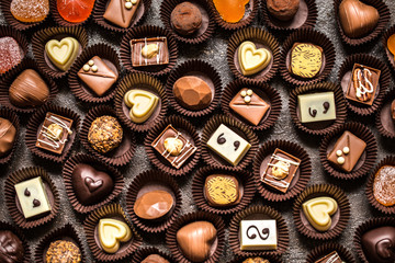 The range of chocolates, sweets on dark background